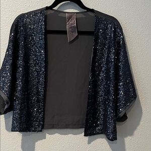 Charcoal Sequined Sparkling Cropped Kimono
Lots of Bling.
Sz L
Moon Collection